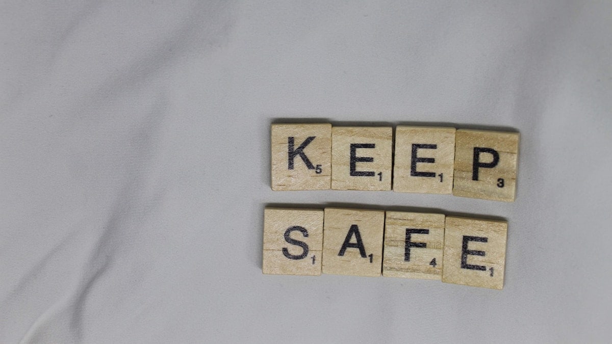 KEEP SAFE letter tiles on white background